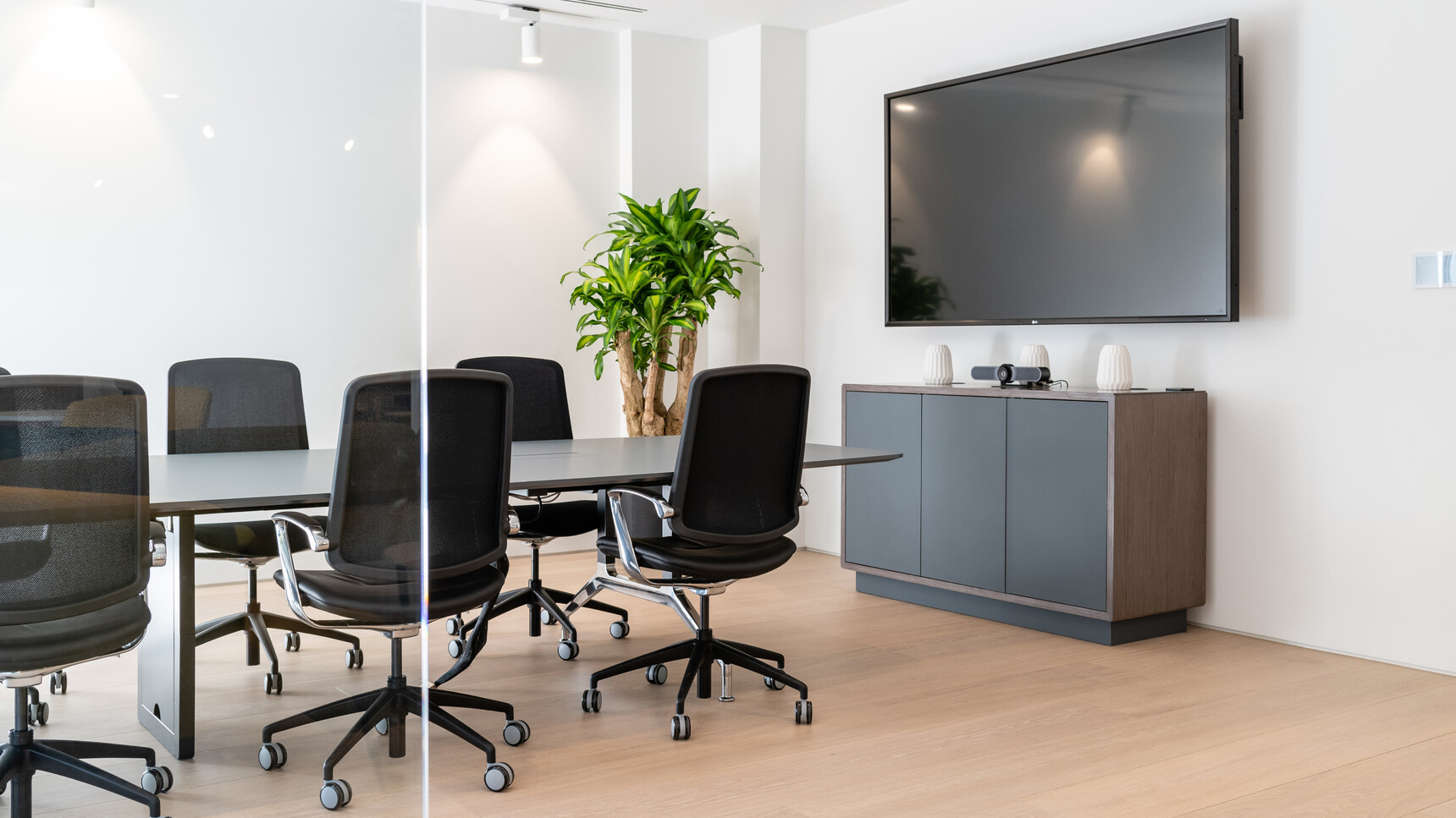 Boss Design 740H Credenza with Plinth Base & Doors Three Touch Latch Doors Black Wood Frame Finish Black Plinth Base Six Trinetic Mesh Seat & Back At Desk