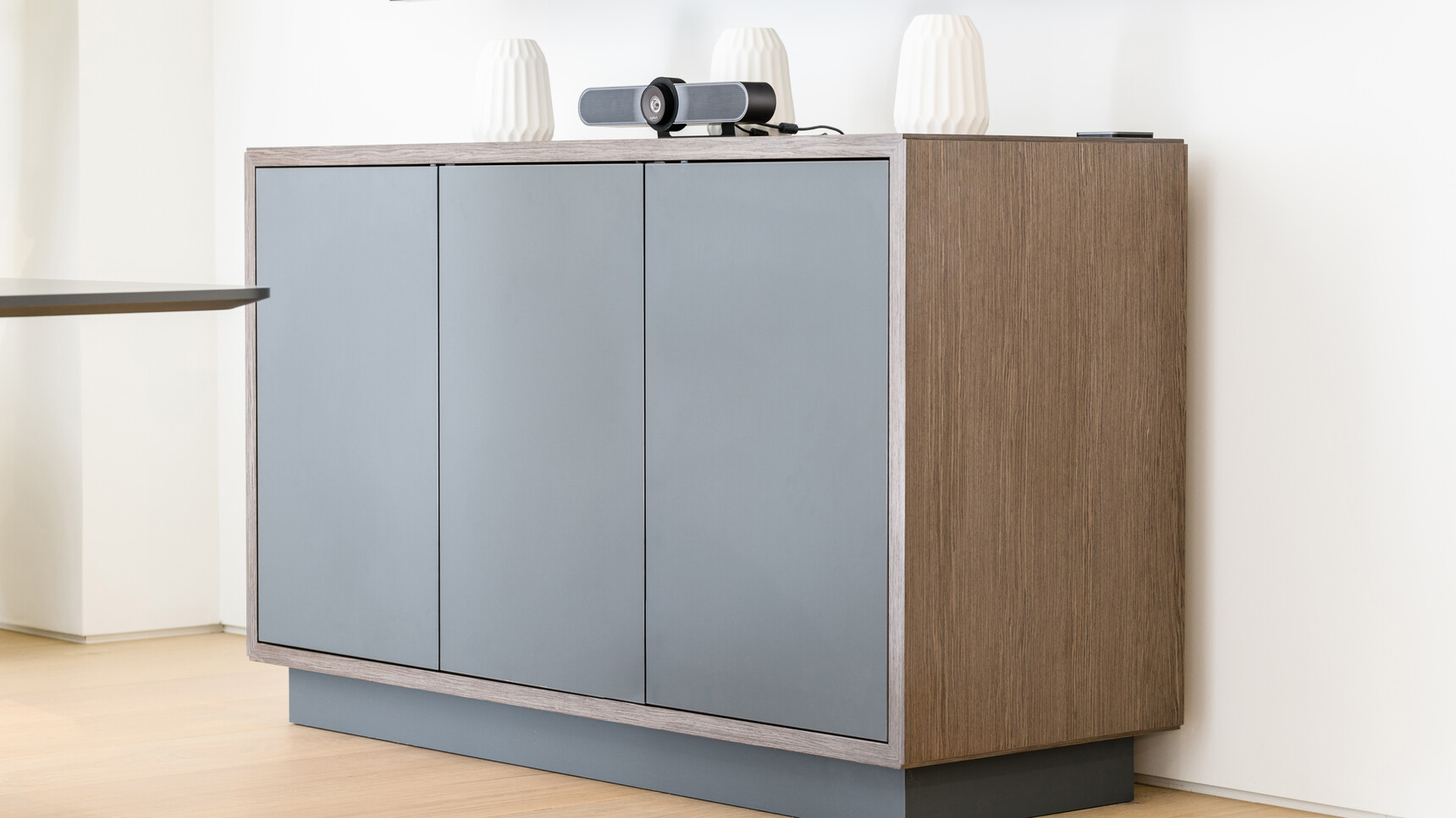 Boss Design 740H Credenza with Plinth Base & Doors With Three Touch Latch Doors In Black Finish And Wood Frame Finish With Black Plinth Base Against Wall