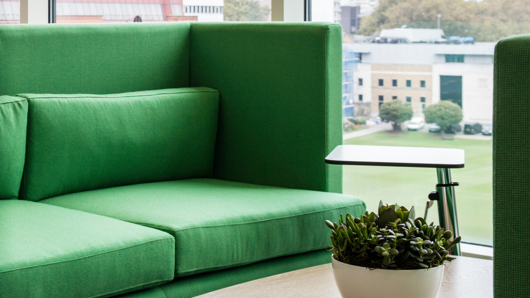 Two Boss Design Arthur Large Sofas In Green Upholstery Facing Each Other At Coffee Table With Laptop Table At Sofa