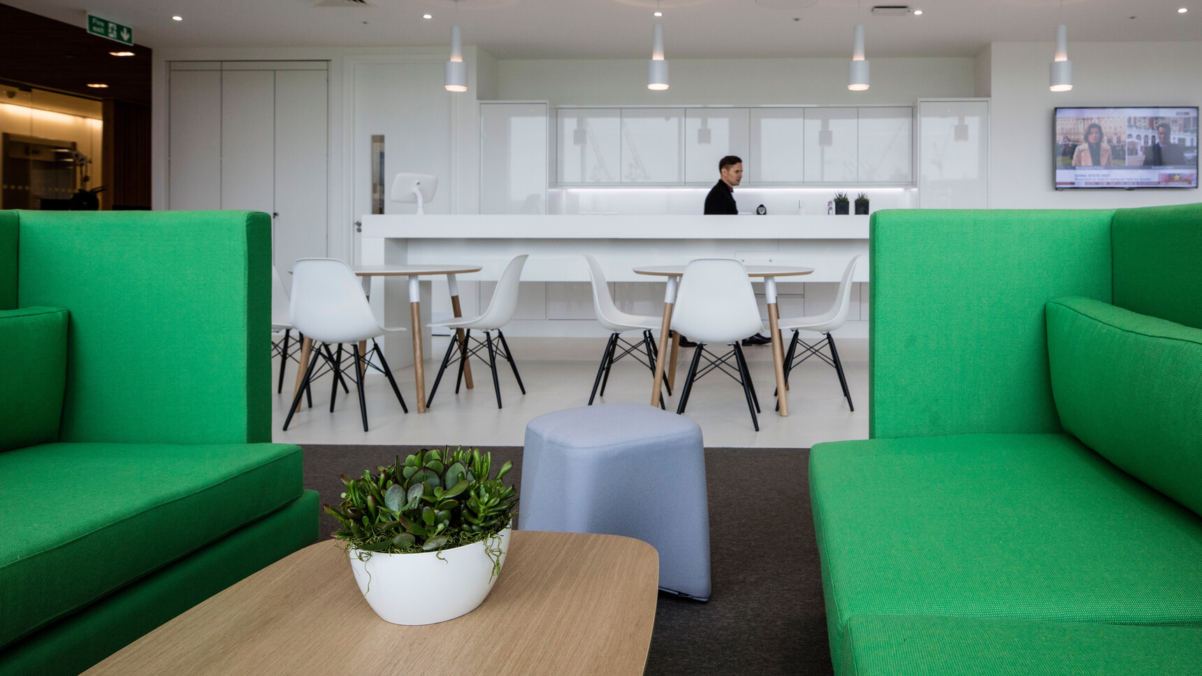 Two Boss Design Arthur Large Sofas In Green Upholstery Facing Each Other At Coffee Table With Stool At Sofa In Kitchen Environment