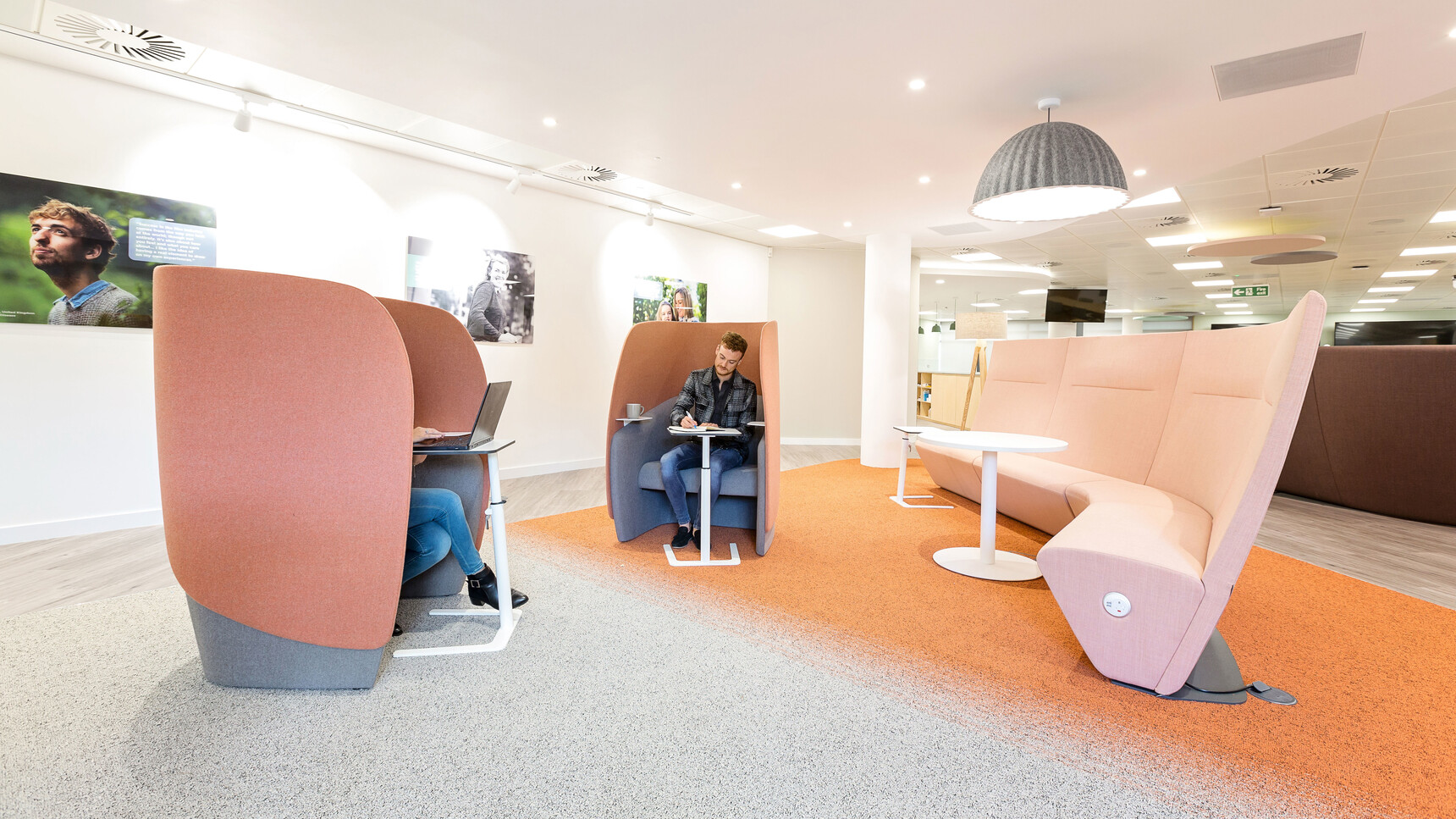 Three Boss Design Flamingo Laptop Tables With White Finish Two At Booths With The Booths In Use By Two People
