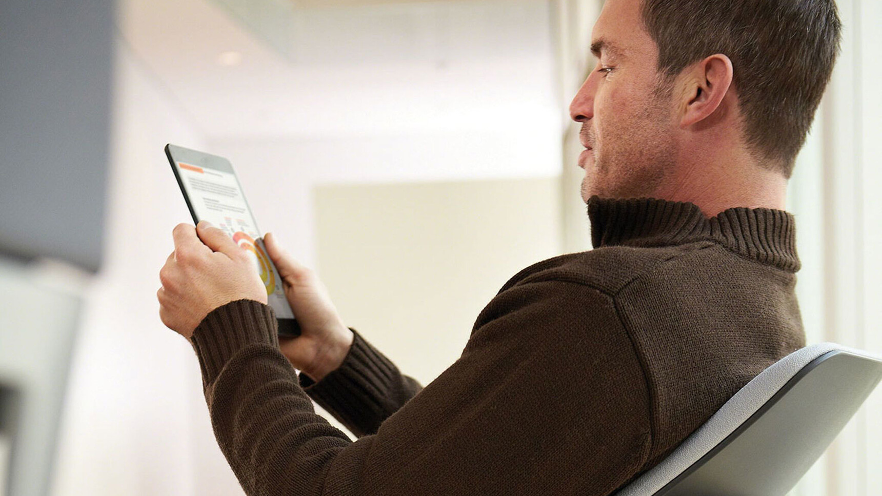 Steelcase Gesture Shell Back Office Chair With White Upholstery And Black Frame In Use By A Person On A Tablet Detail Image