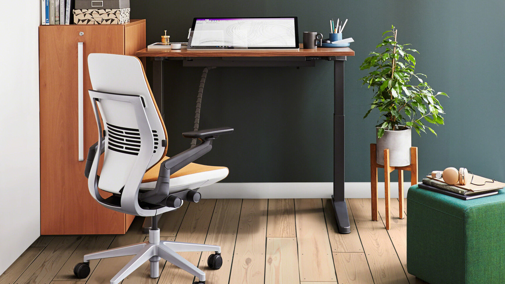 Steelcase Gesture Shell Back Office Chair With Orange Upholstery And White Grey Frame With Grey Base On Castors At Height Adjustable Desk