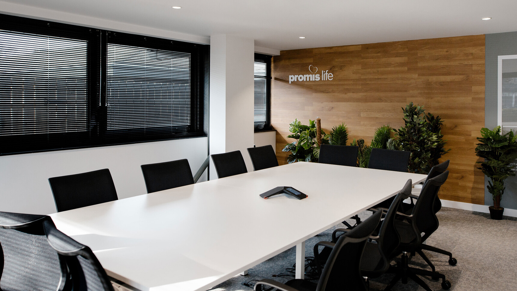 Eleven Boss Design Kara Office Chairs with Arms In Black Upholstery And Black Frame And Black Leg Base On Castors At Desk