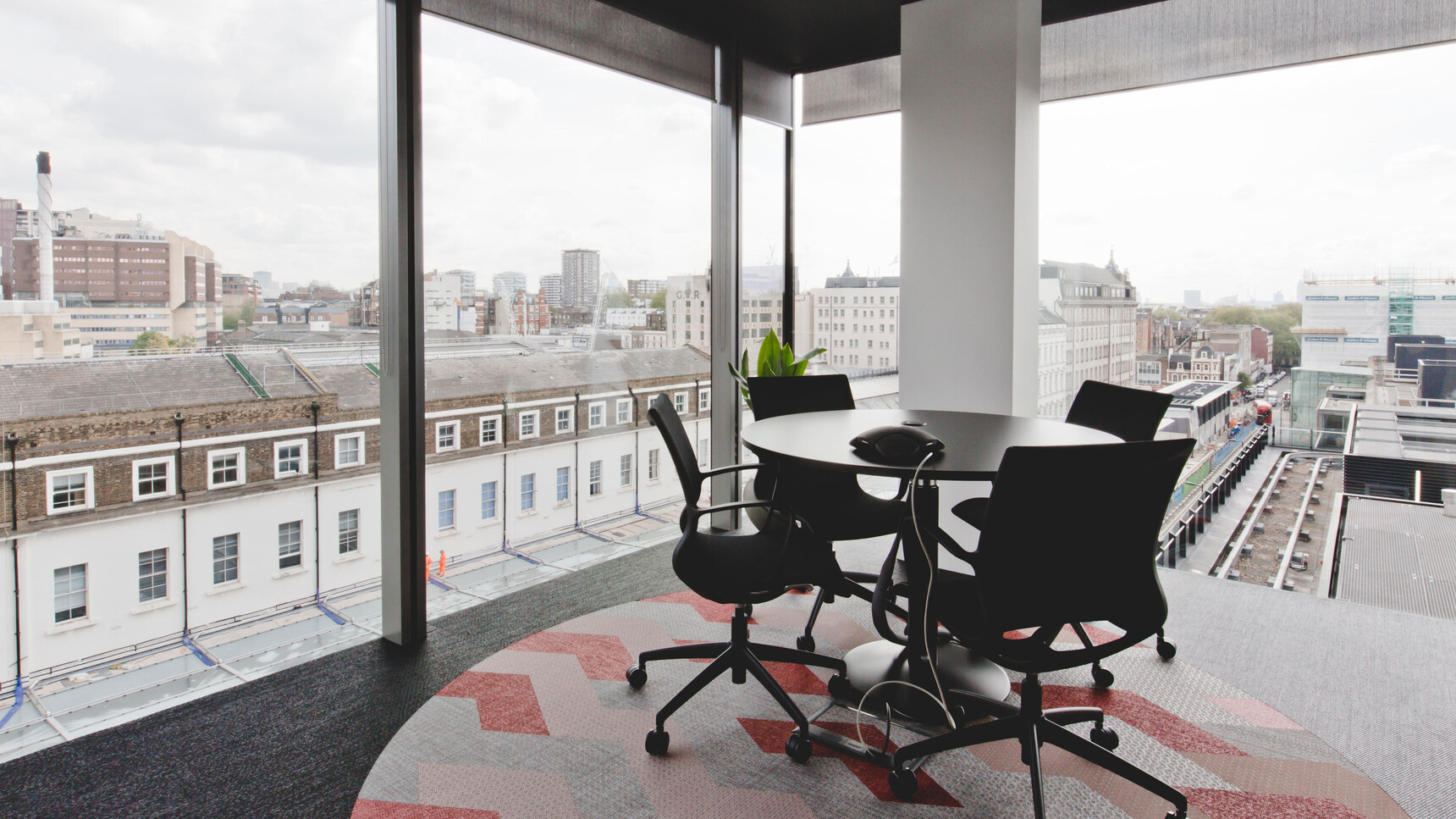 Four Boss Design Kara Office Chairs with Arms In Black Upholstery And Black Frame And Black Leg Base On Castors At Desk