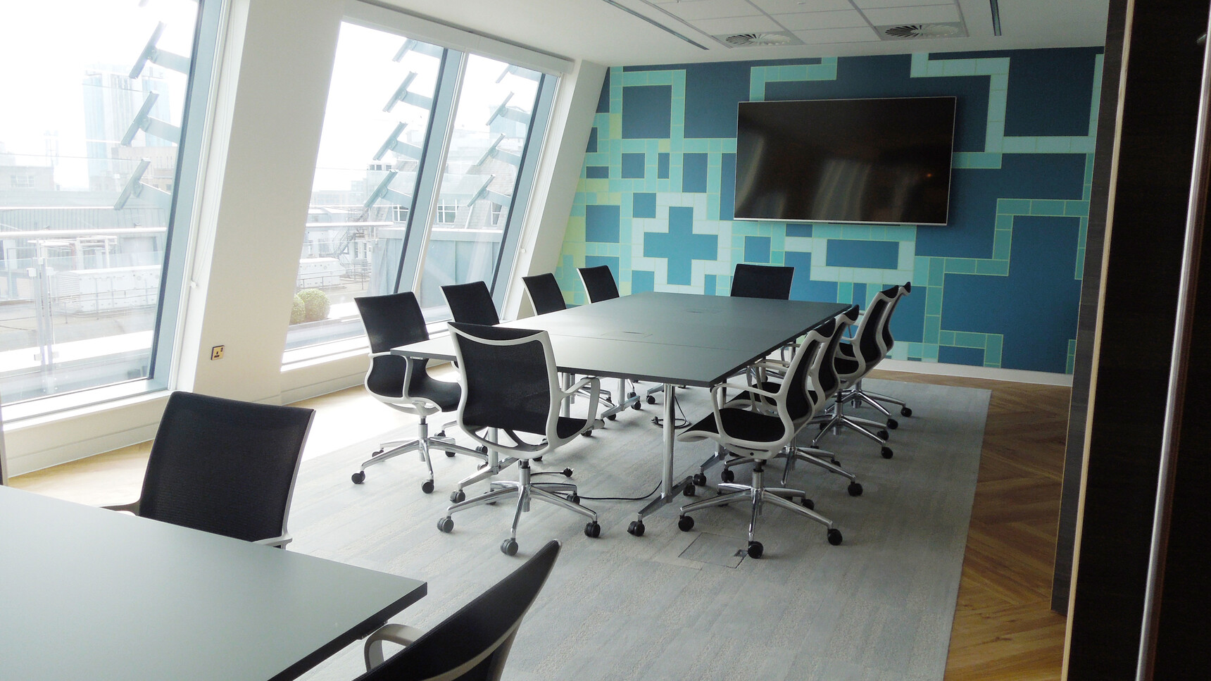 Ten Boss Design Kara Office Chairs with Arms In Black Upholstery And White Armrests And Polished Aluminium Base On Castors At Four Flip Top Tables