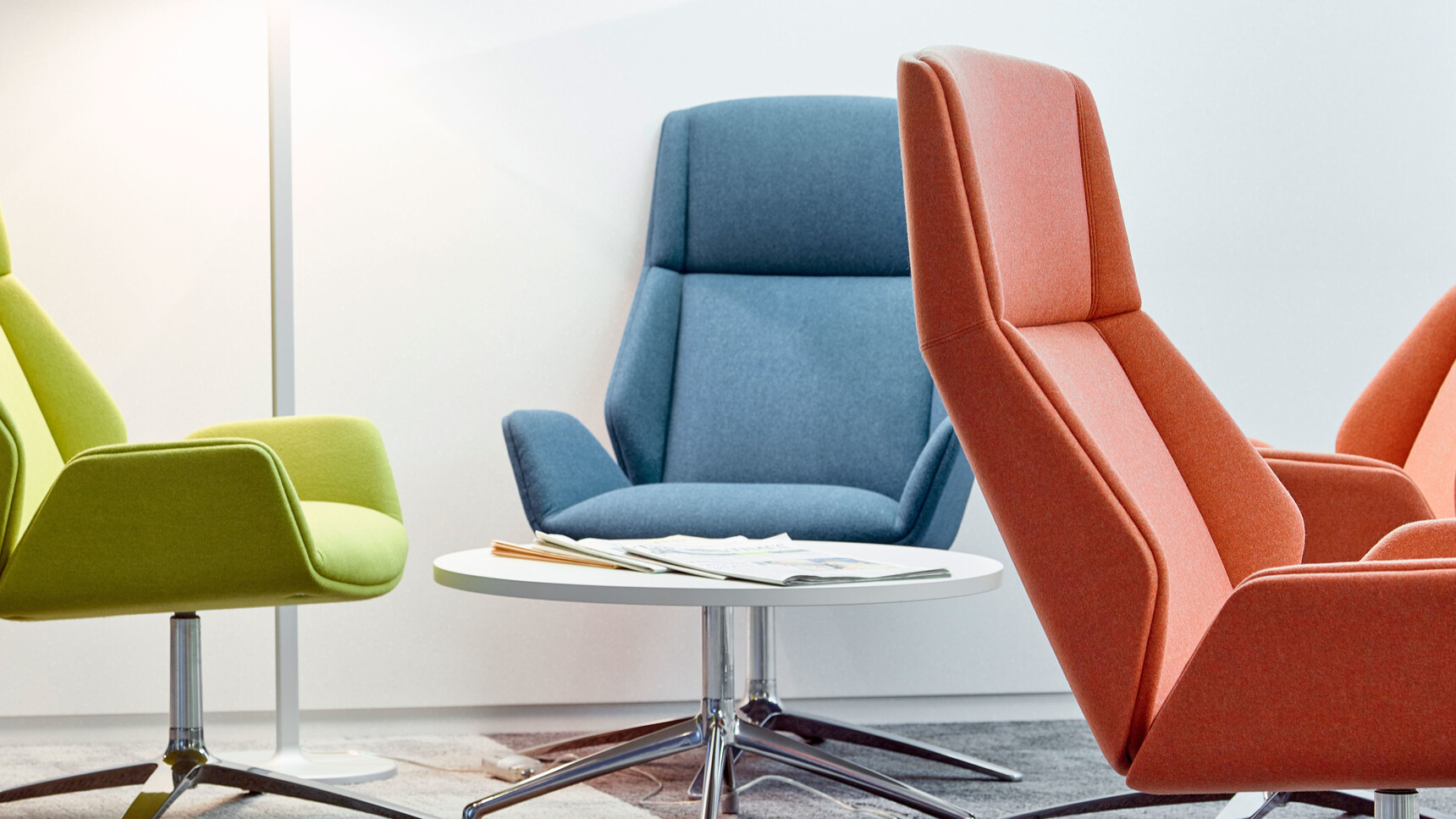 Four Boss Design Kruze Lounge High Back Chairs One In Green Blue And Orange Upholstery And Polished Aluminium Base At Coffee Table With White Table Top And Polished Aluminium Base Detail Image