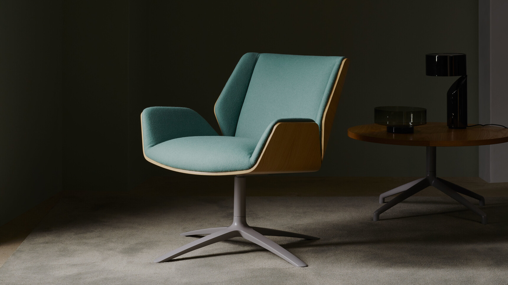 Boss Design Kruze Lounge Low Back Chair With Green Upholstery And Wood Finish And Grey Leg Finish With Table And Lamp Front Quarter Angle