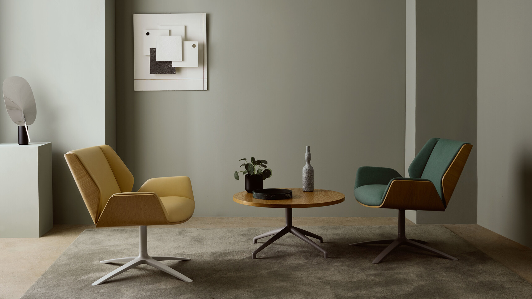 Two Boss Design Kruze Lounge Low Back Chairs One With Green Upholstery And Wood Frame Finish With Grey Base And One With Yellow Upholstery And Wood Frame Finish And White Leg Finish At Table