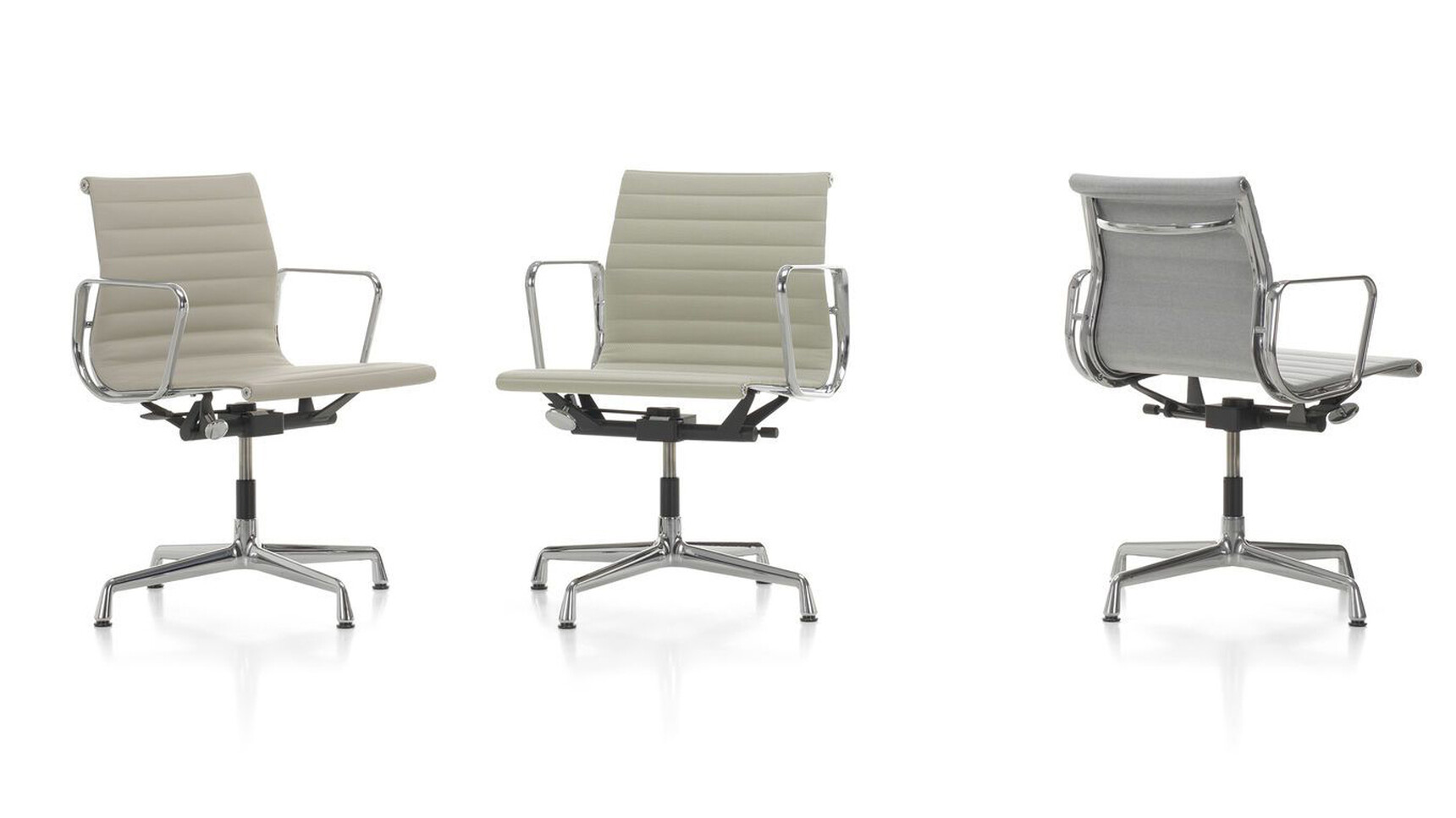 Three Charles & Ray Eames Aluminium EA132 Chairs White Background