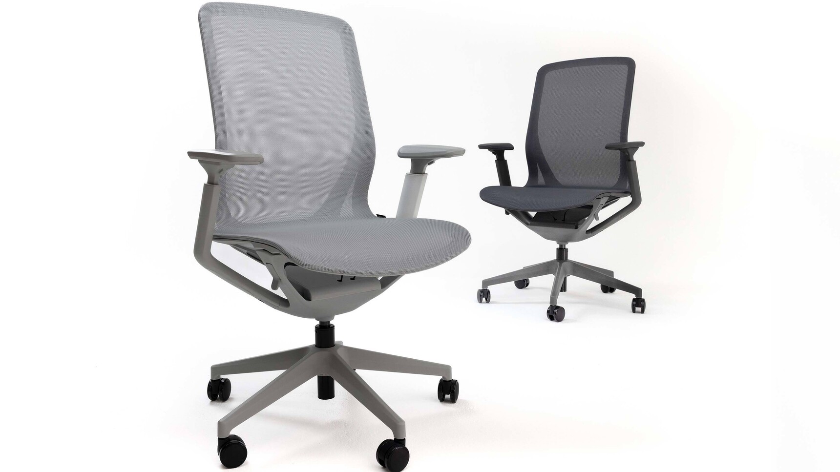 Two Haiken Hunt Mesh Back Office Chairs Grey Finishes White Background