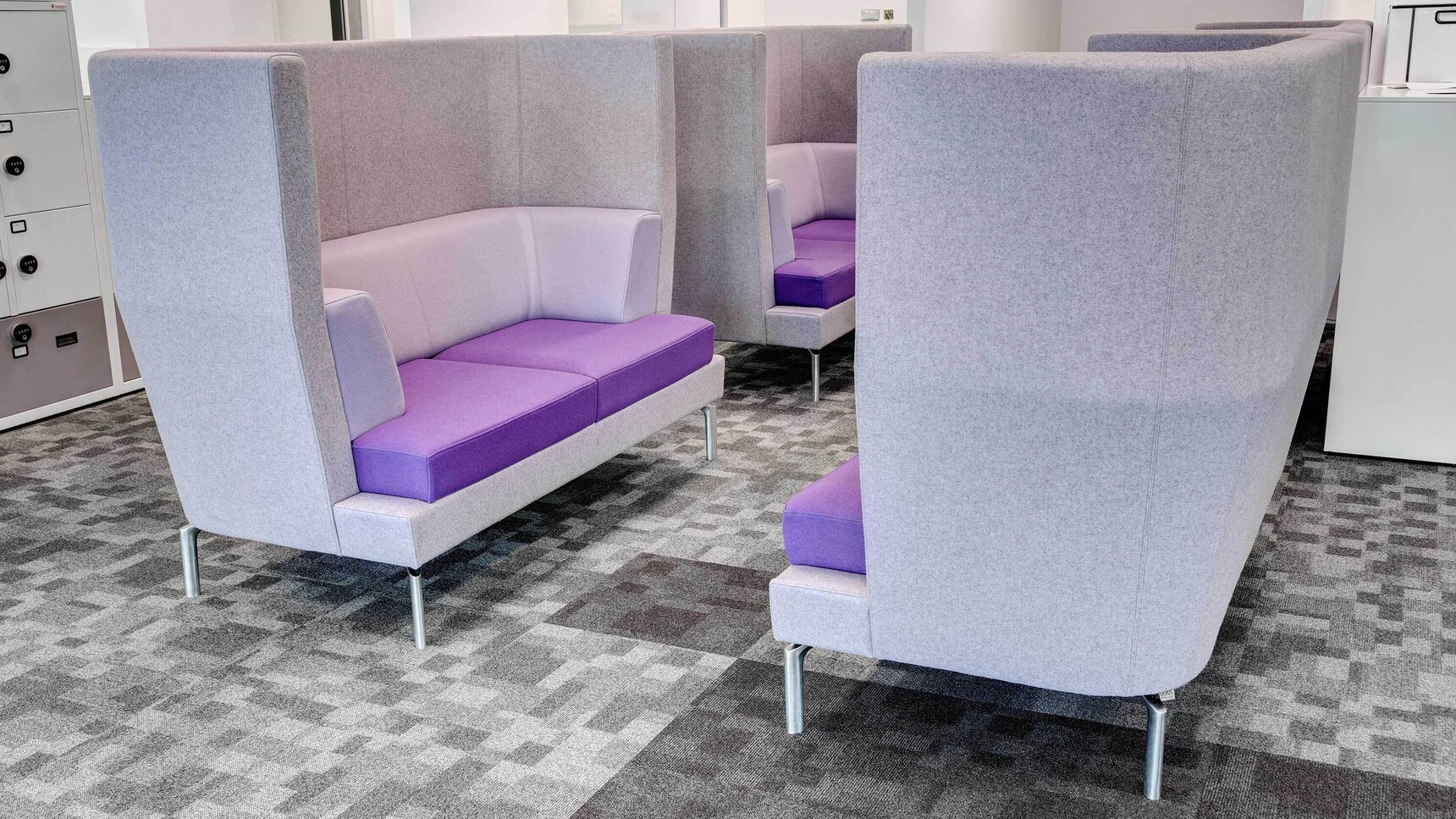 Four Entente Two Seater High-Back Sofas Purple Cushion In Office Setting