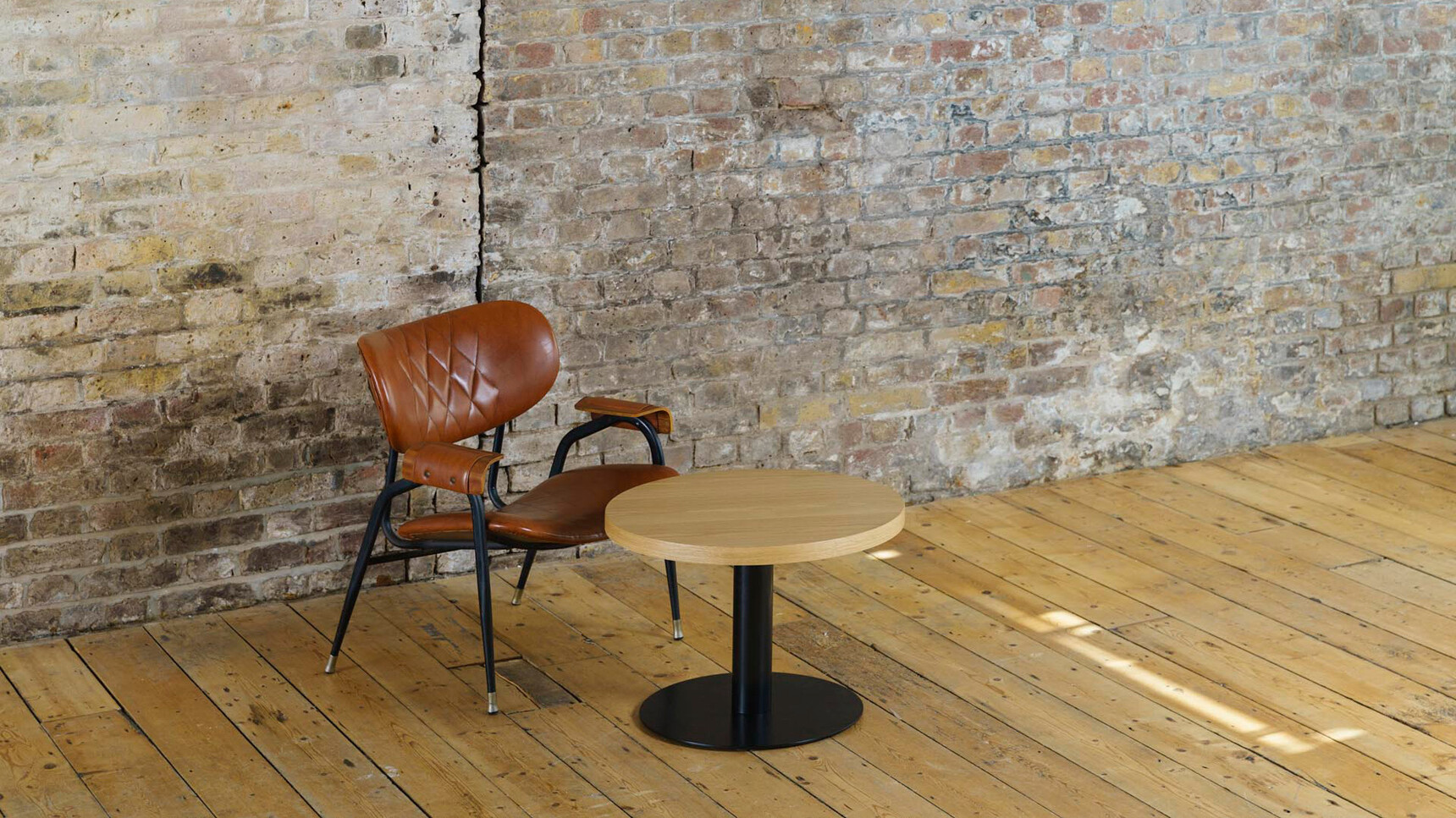 Workstories Pedestal Pound Coffee Table Wood Top Black Base In Situ