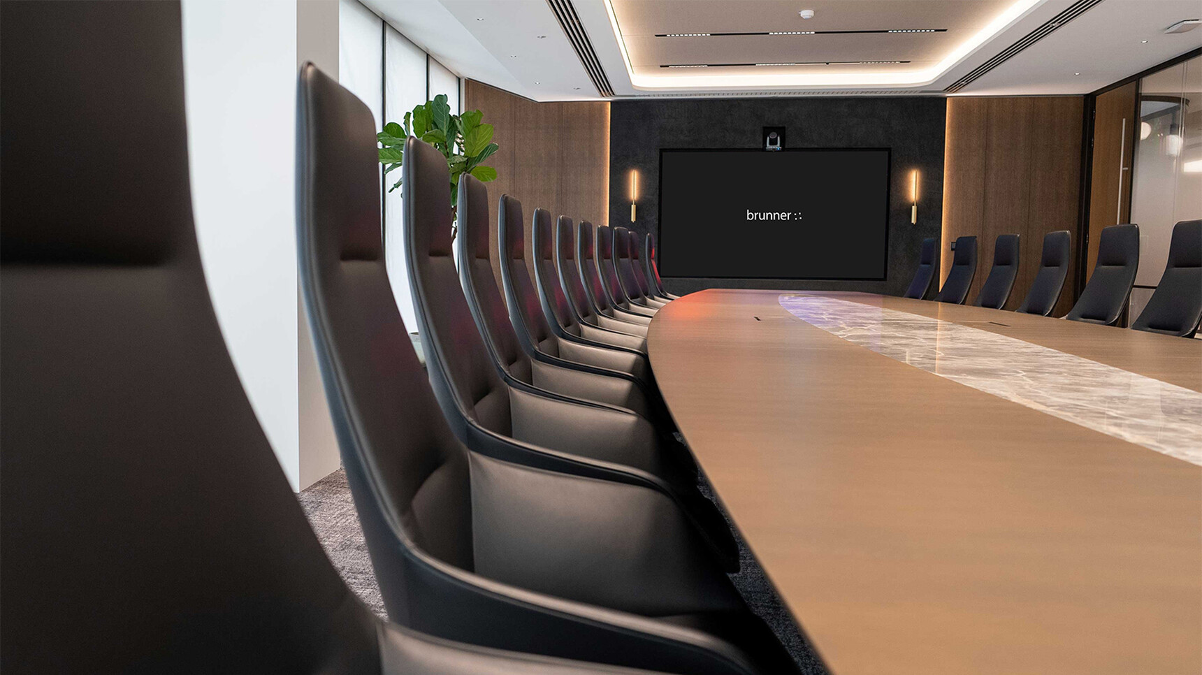 Brunner Ray Soft Swivel High Back Chairs With Integrated Arms Four Star Base On Glides Leather Fabric In Office Setting