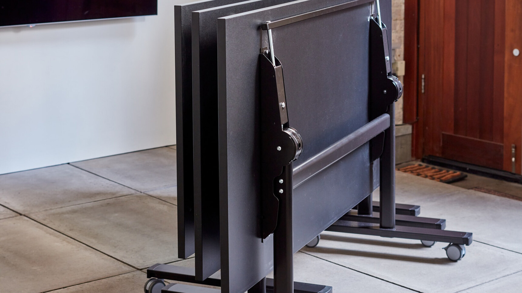 Workstories Three FlipTop Meeting Tables Black Finishes Tilted Detail Image