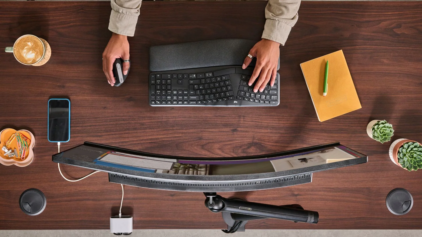 CBS Flo Single Monitor Arm Black Finish On Desk In Situ