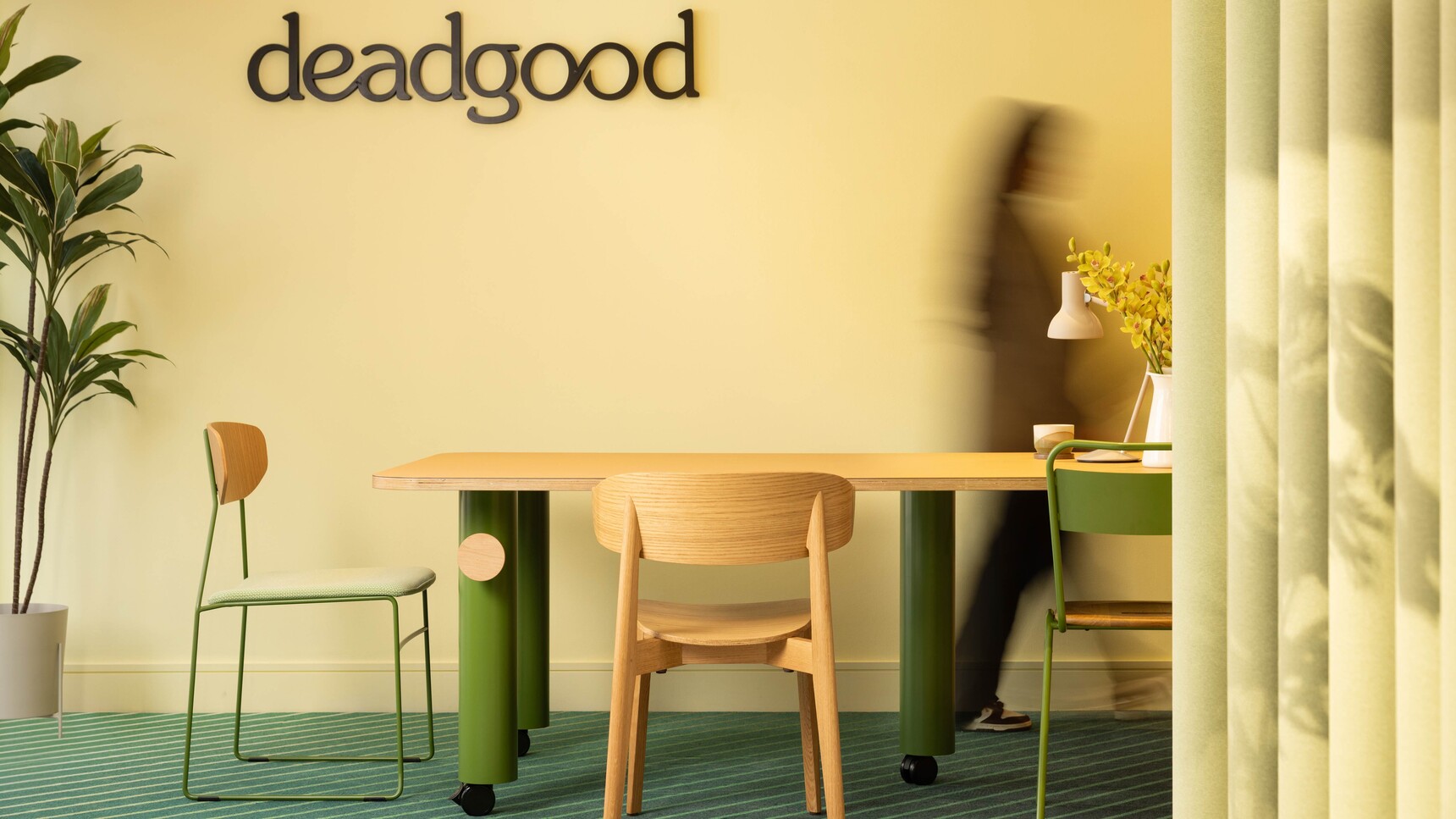 Deadgood Branch Meeting Table Wood Top Green Legs In Situ With Person