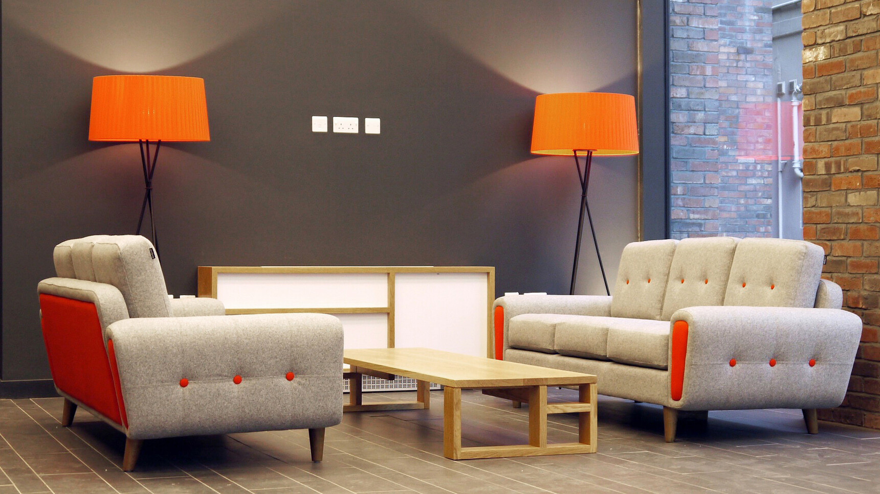 Deadgood Harvey Sofas | 3 Person White Upholstery With Orange In Office Setting