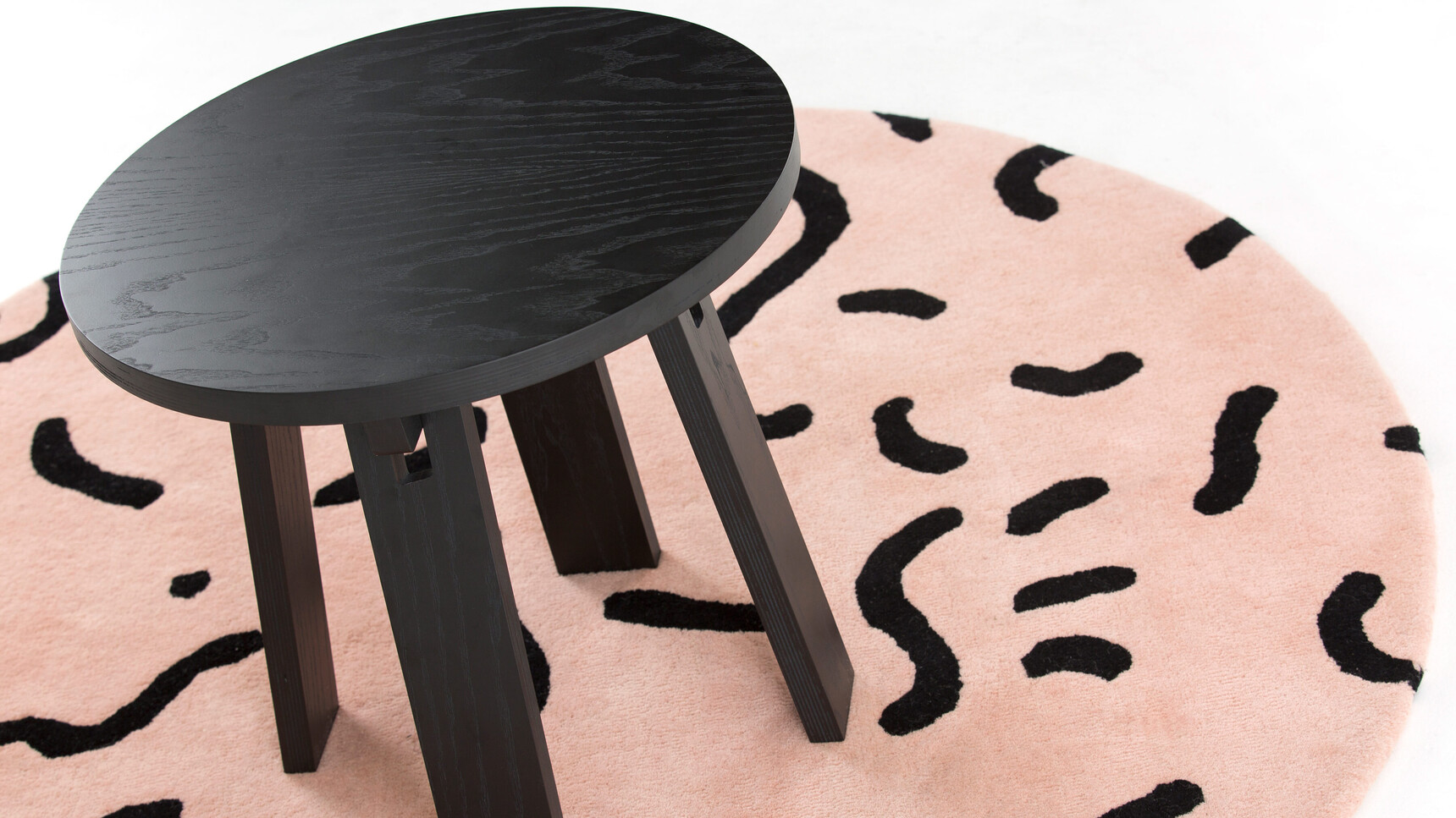 Deadgood Marra Side Table Jet Black RAL 9005 Finish On Rug Family Image