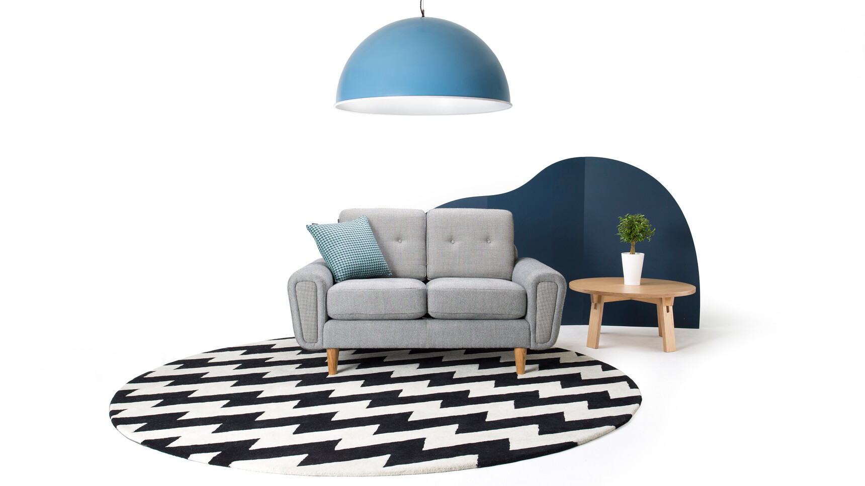 Deadgood Spun Light | Large Blue Finish With Harvey Sofa Grey Upholstery Family Image