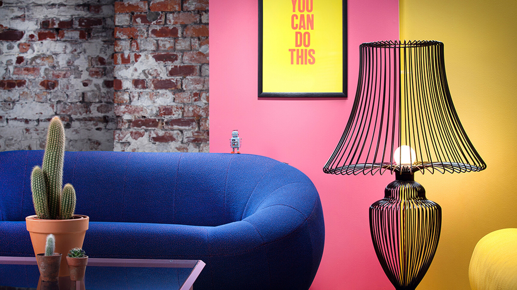 Deadgood Wire Lamp | Large Black Frame Finish On Turn Table With Capsule Sofa Family Image