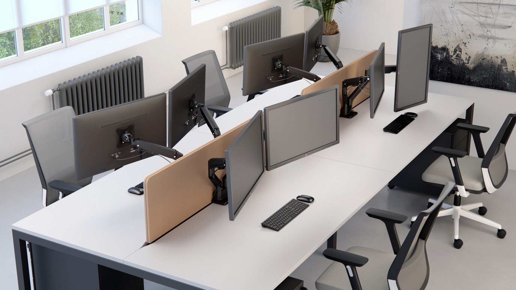 Elite Maya Dual Monitor Arms With Black Matt Finishes On Bench Desks In Office Setting