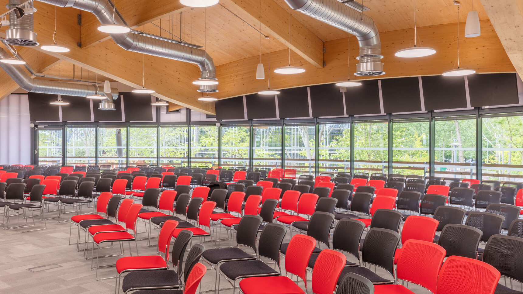 Various Boss Design Starr Armless Meeting Chairs In Red And Black Upholstery And Chrome Base In Rows