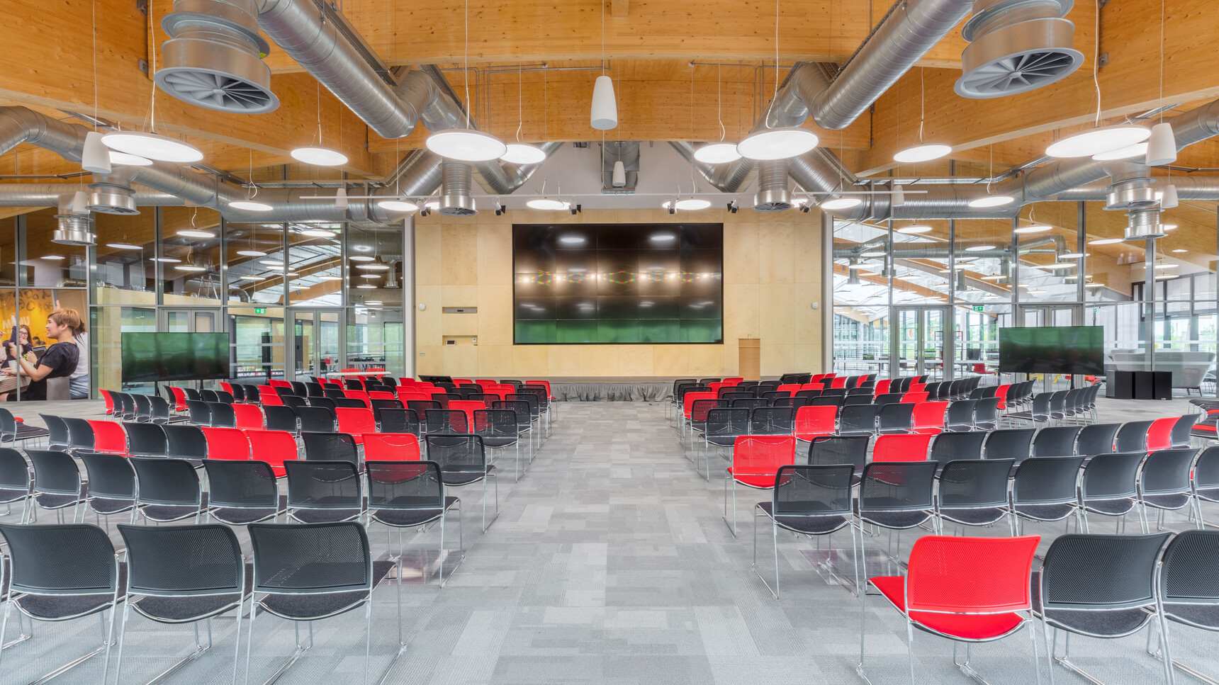 Various Boss Design Starr Armless Meeting Chairs In Red And Black Upholstery And Chrome Base At Screen