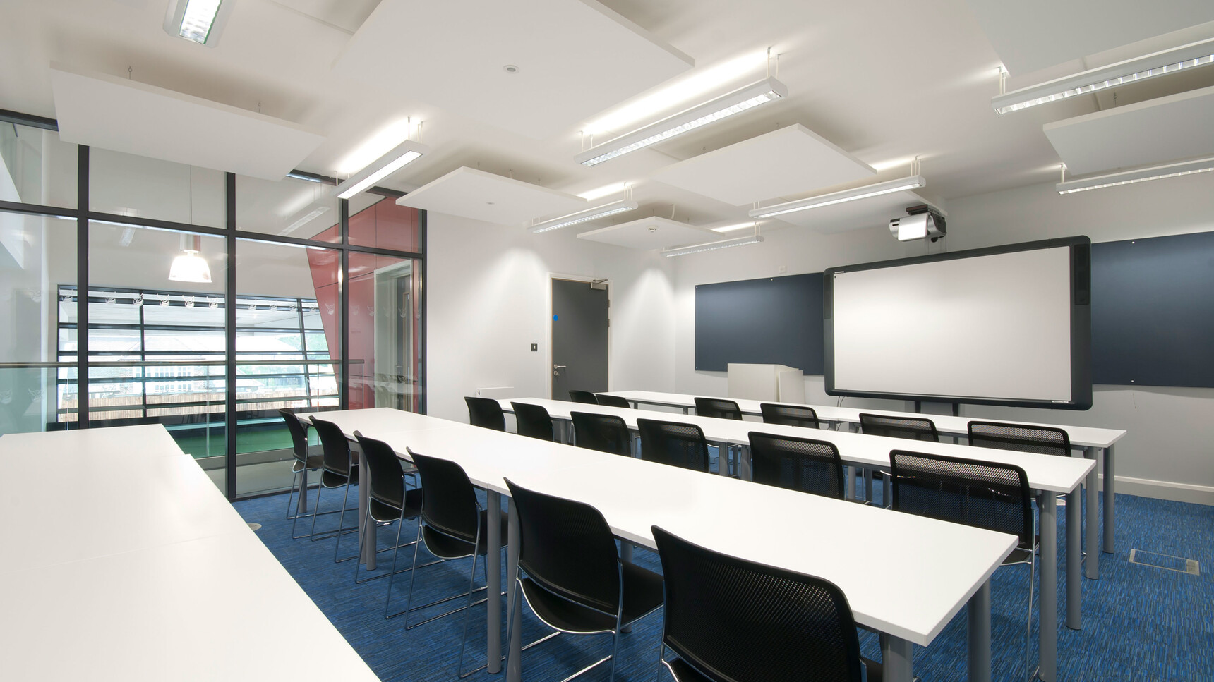 Various Boss Design Starr Armless Meeting Chairs In Black Upholstery And Chrome Base At Desks
