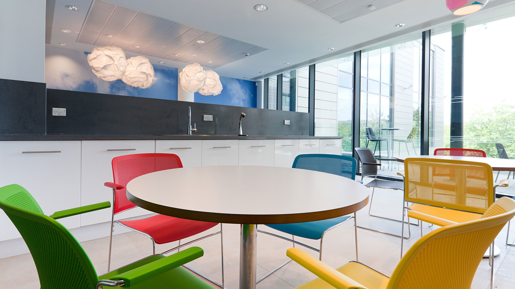 Eight Boss Design Starr Meeting Chairs In Green Red Blue Black And Yellow At Tables