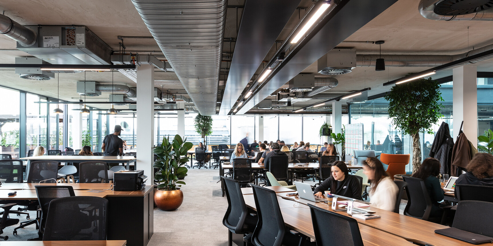 Various Workstories J1 Mesh Back Office Chairs At Desks In Use By Various Workers