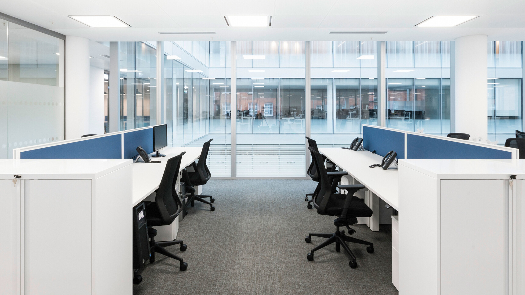 Four Workstories J1 Mesh Back Office Chairs Black Upholstery Finish At Desks White Finish Blue Screens