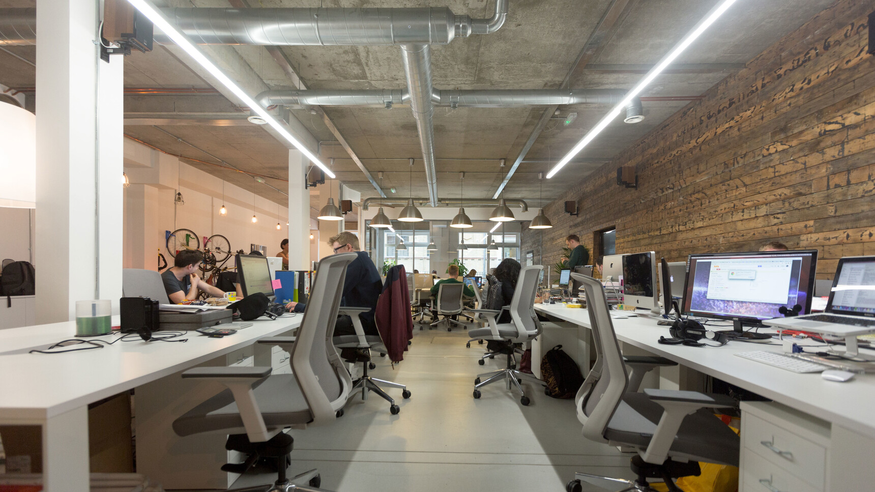 Various Workstories J1 Mesh Back Office Chairs Polished Base Grey Upholstery At Desks In Office Environment