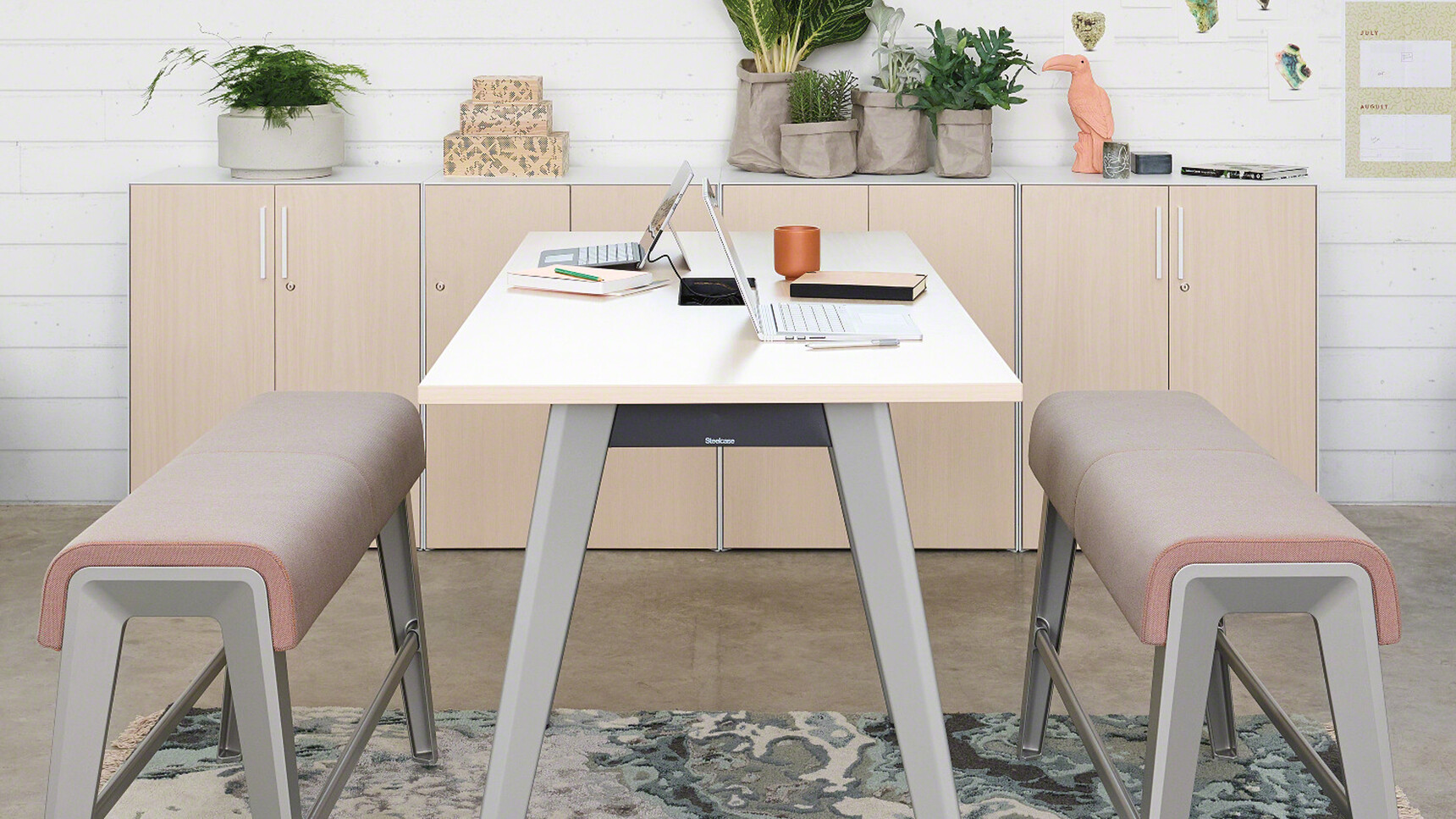 Steelcase Two B-Free Beam Benchs With  Aluminium Legs And  Pink Fabric At Desk With B-Free Desk With Silver Aluminium Legs And Wood Finish In Office Environment