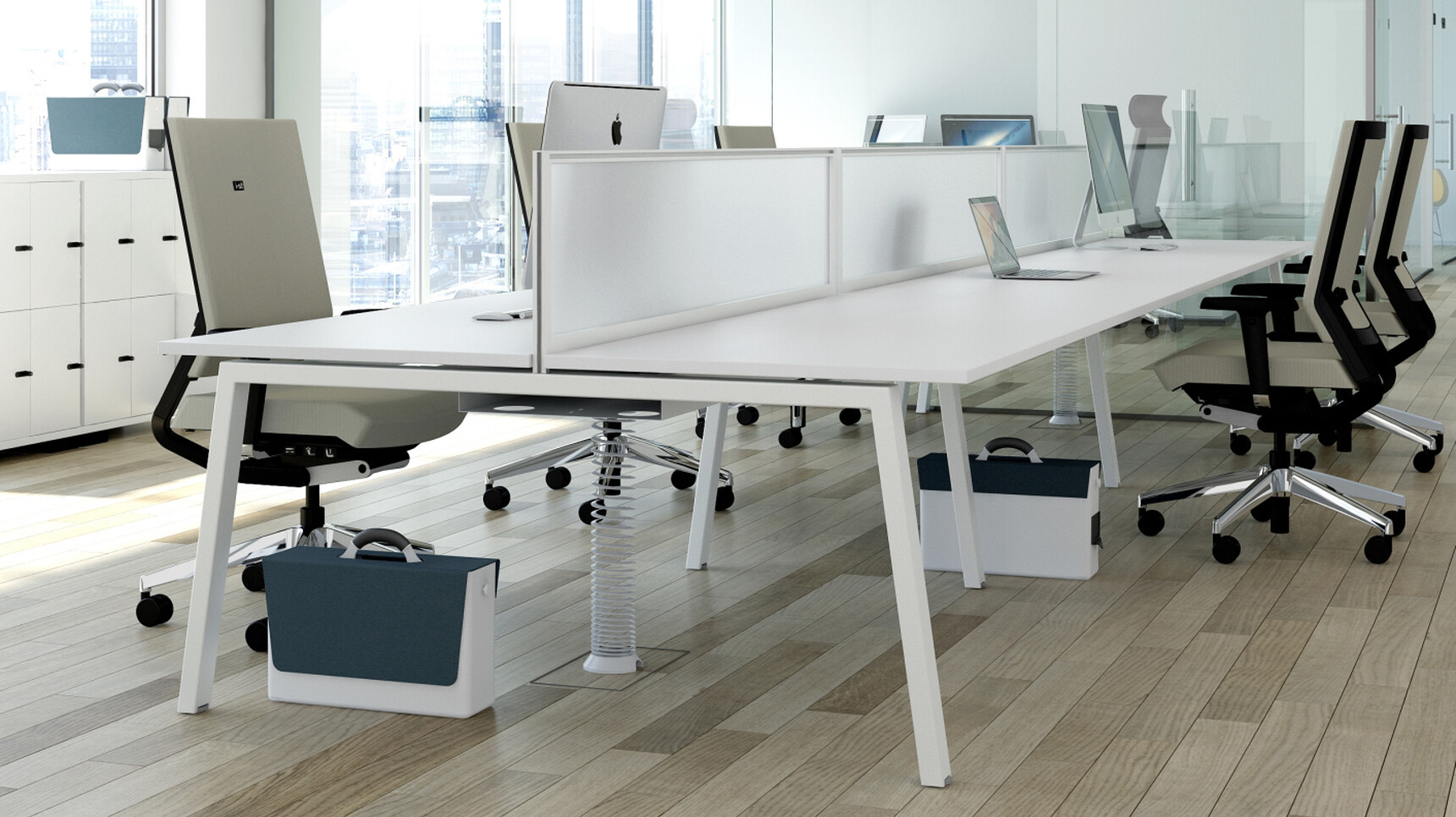 Elite Linnea Double Bench Desk With White Table Top Finish And White Metal Leg Finish With Five Elite Task Chairs With Grey Backrests And Grey Upholstery At Desks In Office Environment