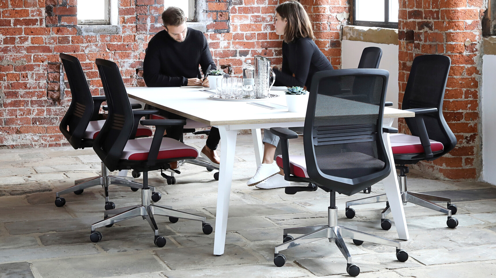 Elite Lux Octagonal Conference Table White Top Wood Edge Finish White Leg Finish Six Vida Mesh Back Office Chairs Black Backrest White Seat Upholstery Red Seat Edges