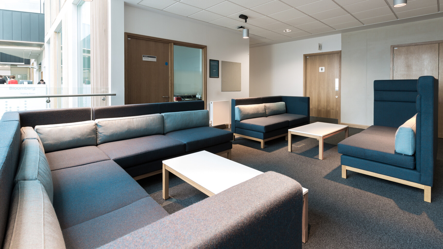 Boss Design Arthur Cityscape With Dark Grey Blue Upholstery With Wood Leg Finish In Three Sections With Low And High Seating At Two Coffee Tables