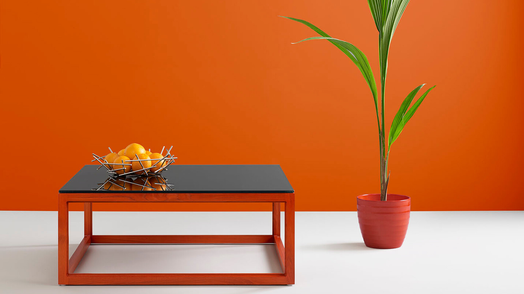 Boss Design Metro Large Rectangular Coffee Table With Black Table Top And Orange Wood Finish With Plant