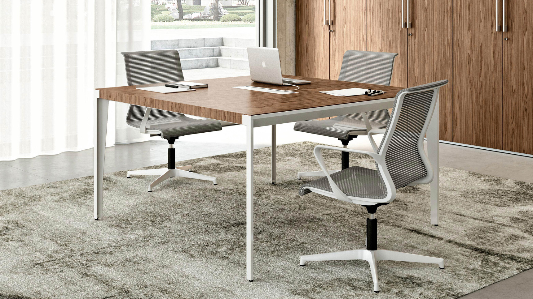 Quadrifoglio X9 Wood Veneer Meeting Table With Wood Finish With White Leg Finish And Quadrifoglio Chairs With Grey Upholstery And White Armrest And Frame And White Base On Four Star Base At Desk