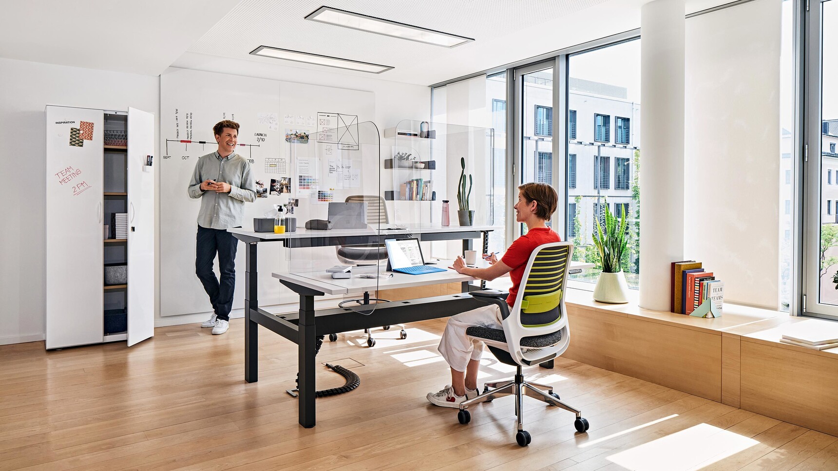 Two Series Series 1 Office Chairs At Migration Height Adjustable Desk In Office Environment