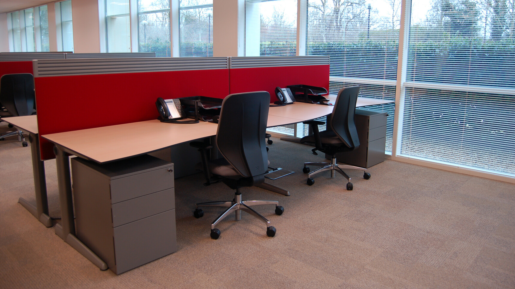 Three Boss Design Lily Upholstered Office Chairs With Dark Grey Upholstery And Black Frame Finish With Polished Aluminium Base On Castors At Desks With Privacy Screens And Pedestals