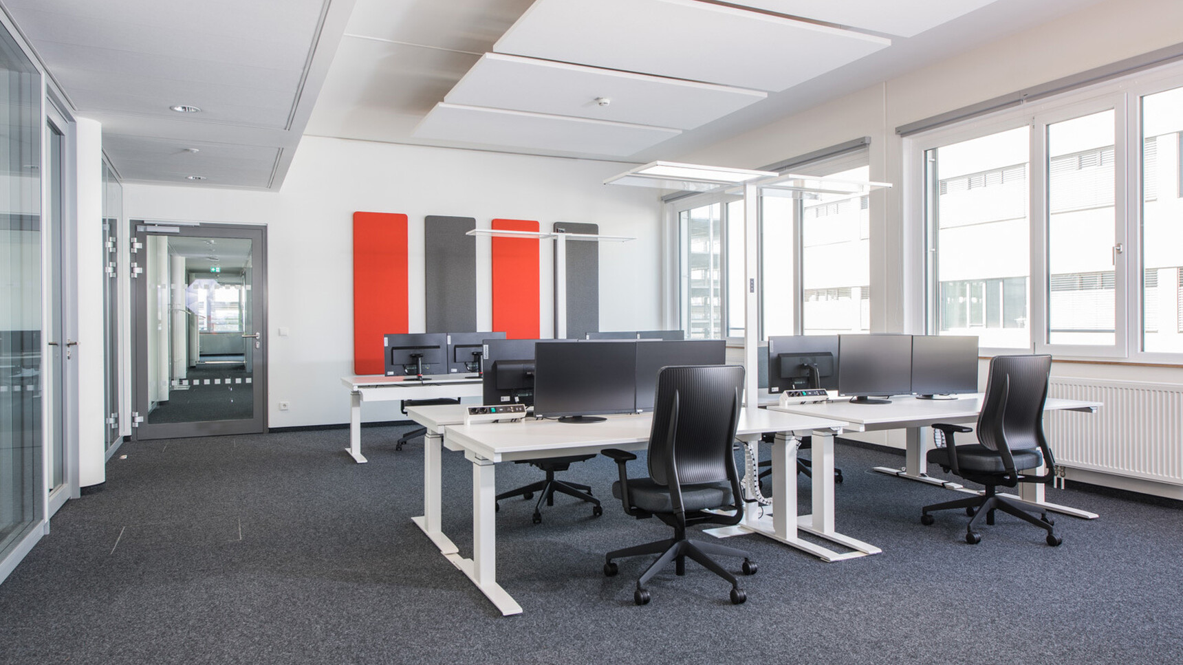Viasit Drumbacks In Blue Upholstery At Desks In Office Environment Image Two