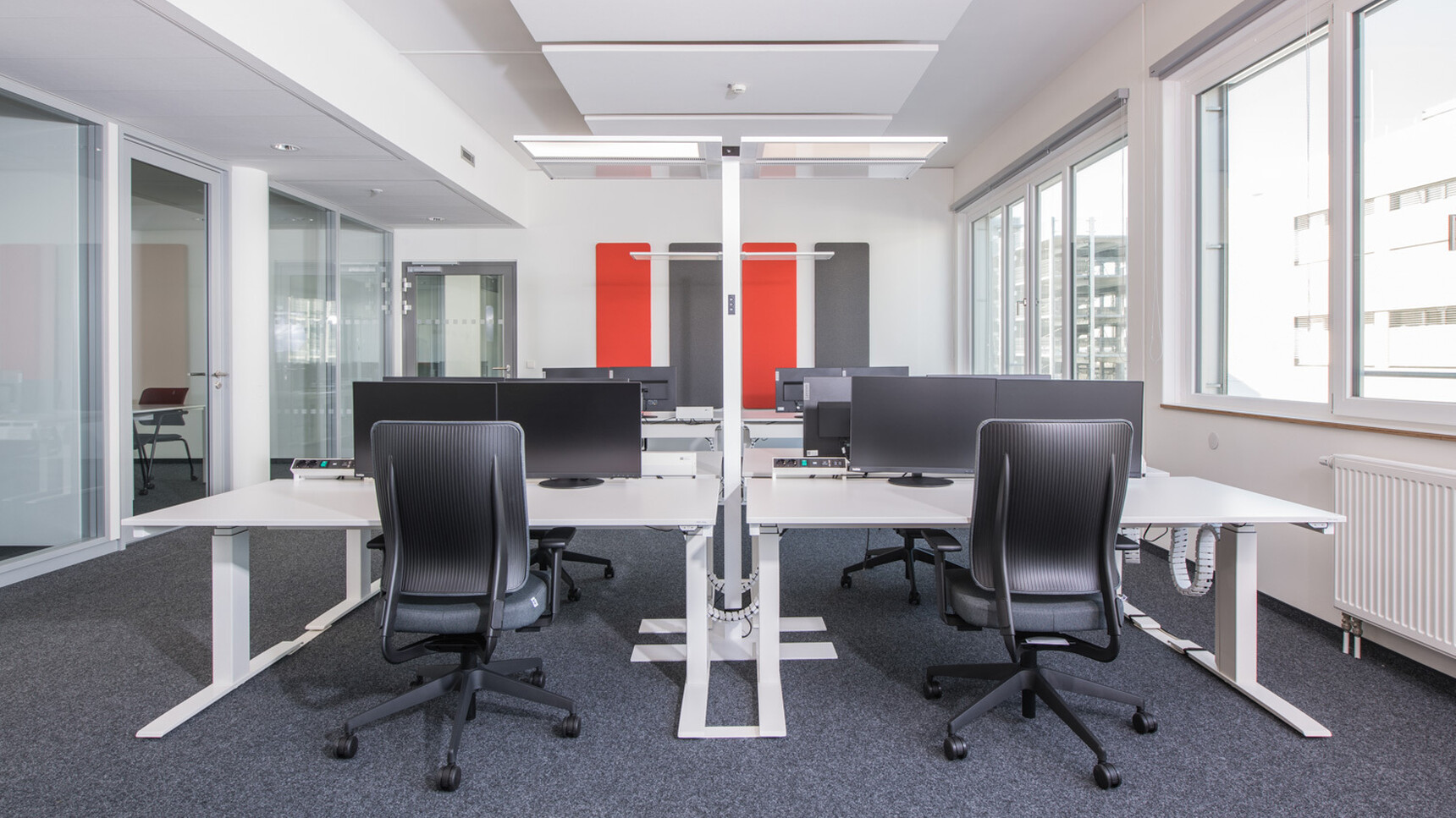 Viasit Drumback In Blue Upholstery At Desks In Office Environment
