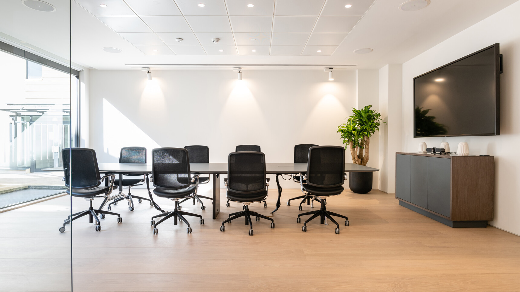 Boss Design 740H Credenza with Plinth Base & Doors With Three Touch Latch Doors In Black Finish And Wood Frame Finish With Black Plinth Base With Eight Trinetic Mesh Seat & Back Office Chairs At Desks