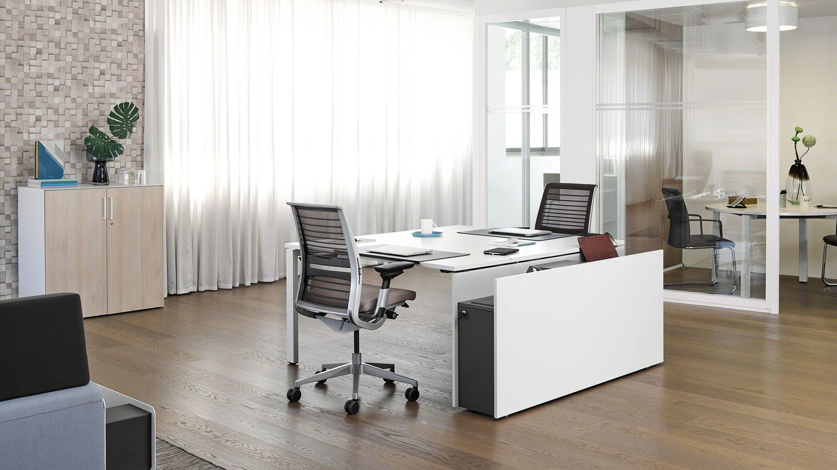 Steelcase Think 3D Knit Back Mesh Back Office Task Chair Insitu At Bench Desk Rear View