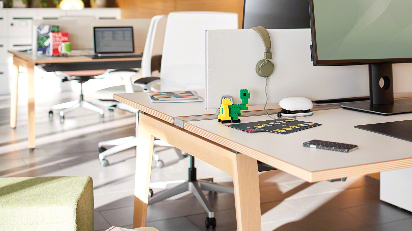 Steelcase Two B-Free Back to Back Desks With  Wood Frame  And White Table Top And  White Fabric And Three White Reply Air Mesh Back Office Chair In Office Environment