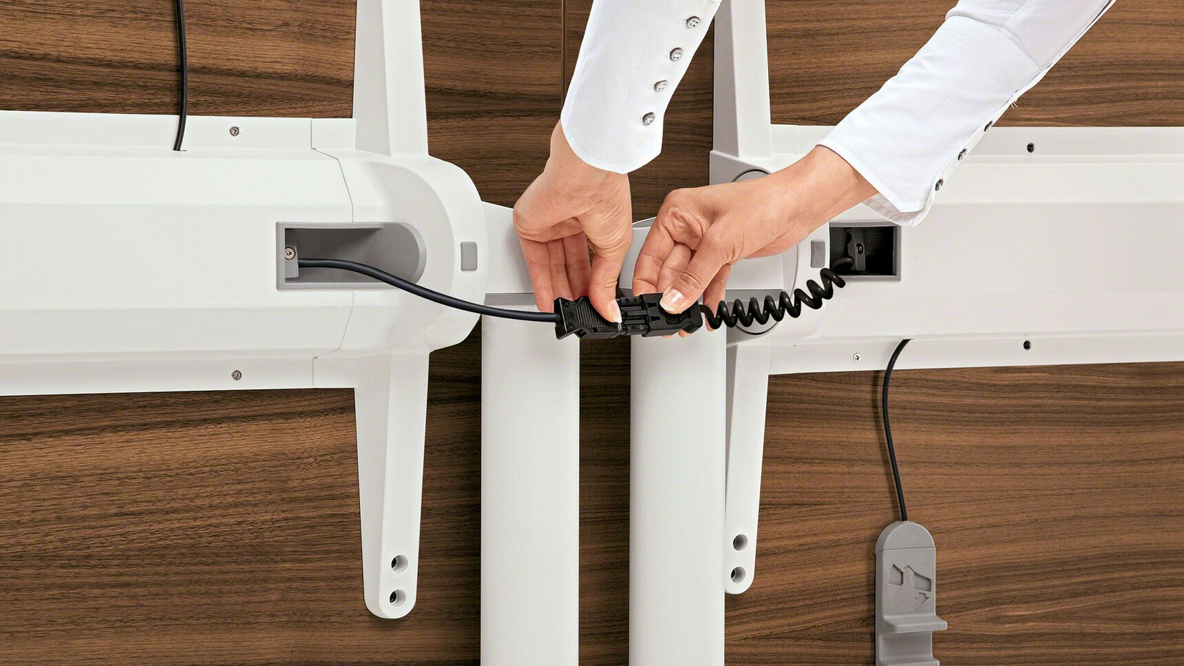 Steelcase Flip Top Twin Rectangular Meeting Table With  White Aluminium Legs And Wood Finish Both Flipped Vertically Close Up Of The Two Tables Connected Person Is Connecting The Two Tables
