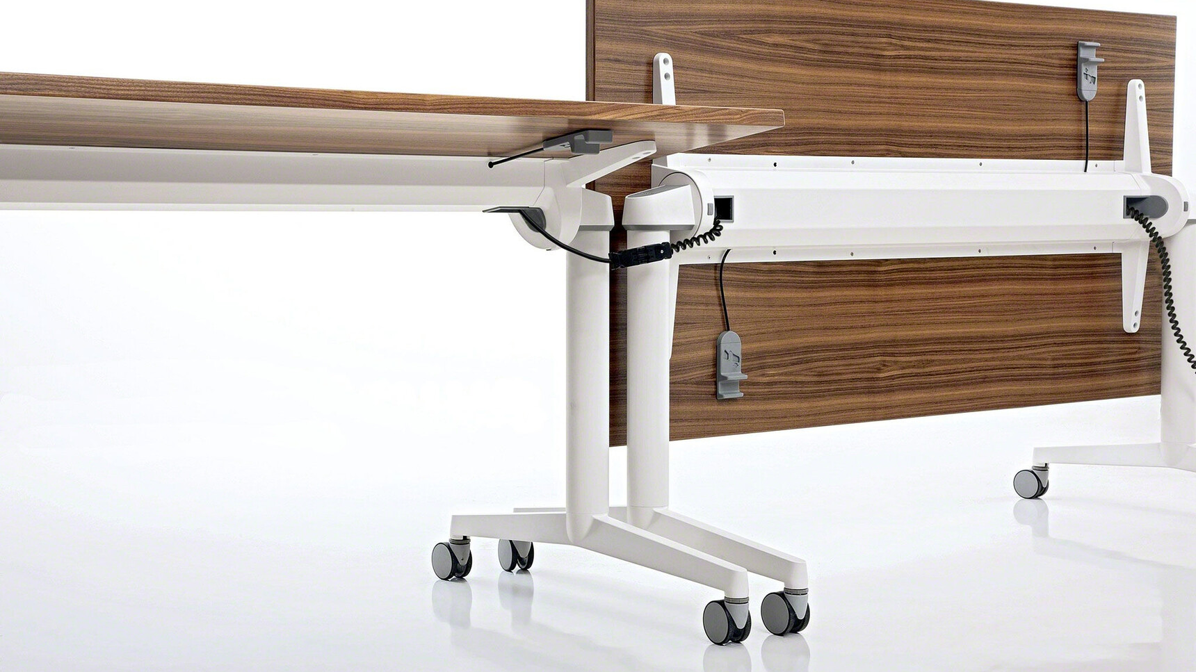 Steelcase Flip Top Twin Rectangular Meeting Table With  White Aluminium Legs And Wood Finish One Top Flipped Up Vertically The Other Horizontal Close Up Of The Two Tables