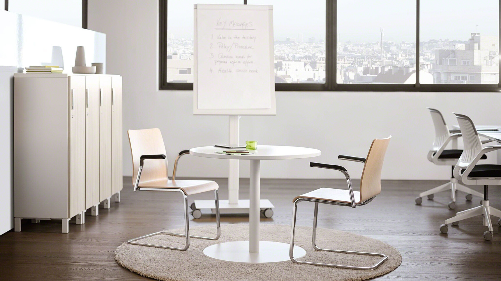 Two Eastside Sled Base Meeting Chairs With Metal Base Finish Wood Finish Backrest Black Fixed Arms And  Wood Finish Seat At Desk With Two Cobi Office Chairs In Office Environment